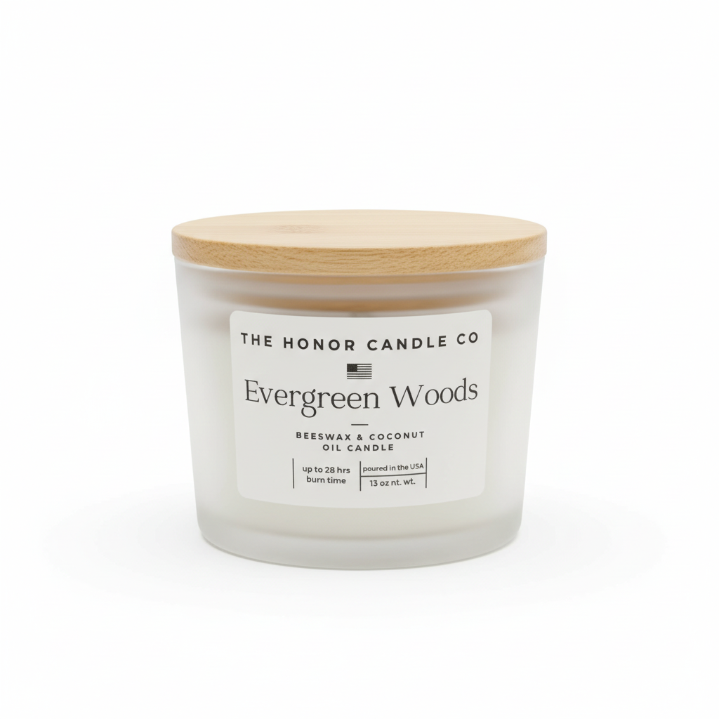 Evergreen Woods candle with wooden lid by The Honor Candle Co, with a white label.
