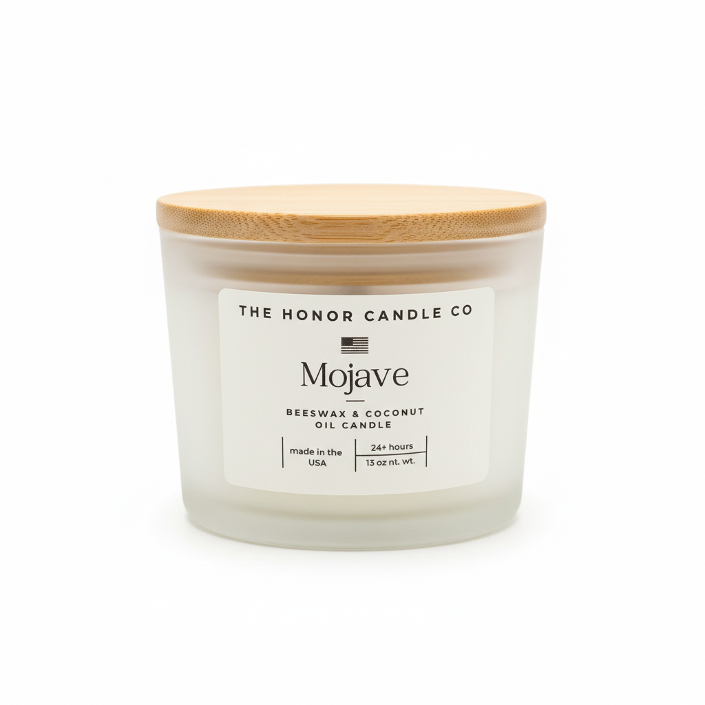 Beeswax and coconut oil Mojave candle from The Honor Candle Co with a frosted glass jar and wooden lid.