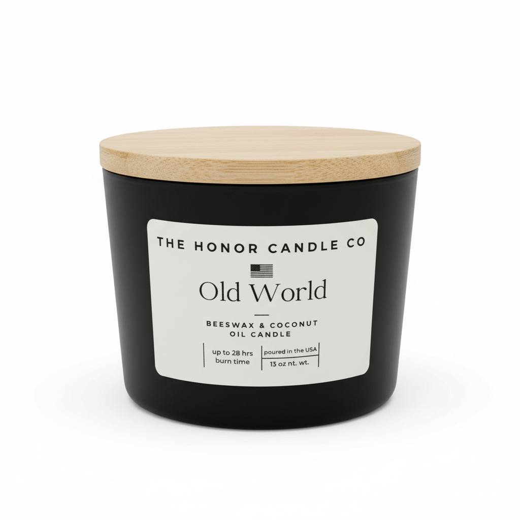 Black candle with a wooden lid from The Honor Candle Co, featuring a white label with black text.