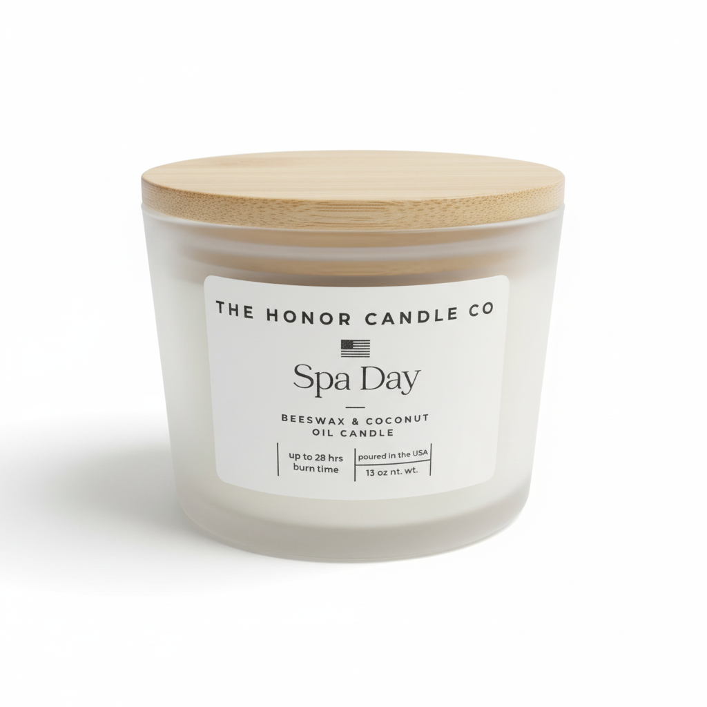 Beeswax and coconut oil candle by The Honor Candle Co, in a frosted glass container with a wooden lid.